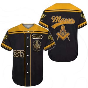 May include: Black and gold baseball jersey with the word "Mason" on the back and the number "357" on the front. The jersey features Masonic symbols and the text "Your Lodge Name" and "Your Name".
