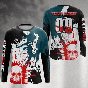 May include: Long-sleeved jersey with a skull graphic and the word "EXTREME" on the sleeves. The jersey features a design with a motorcycle rider, red and black paint splatters, and the number 09 on the back. The text "YOUR NAME" is above the number.