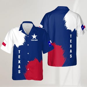 May include: Short-sleeved button-down shirt featuring the Texas state flag design. The shirt is primarily blue, white, and red, with the word "TEXAS" printed vertically. Includes a white star and the text "YOUR NAME".