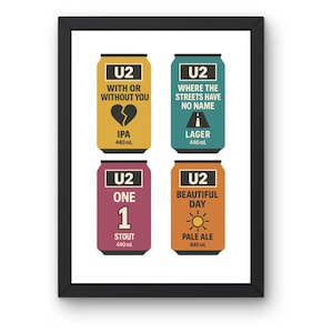 May include: Framed print featuring four beer can designs with the band U2's logo. The cans are labeled "With or Without You" (IPA), "Where the Streets Have No Name" (Lager), "One" (Stout), and "Beautiful Day" (Pale Ale). Each can is 440 mL.