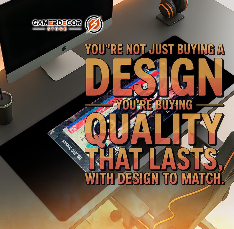 May include: A black gaming mouse pad with a colorful design and the text "YOU'RE NOT JUST BUYING A DESIGN, YOU'RE BUYING QUALITY THAT LASTS, WITH DESIGN TO MATCH." A computer monitor, headphones, and a desk chair are also visible.