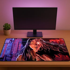 May include: A rectangular mousepad featuring a horror-themed illustration. The artwork depicts a woman with a half-zombie appearance, with long dark hair and a red and black color scheme. The background shows city buildings.