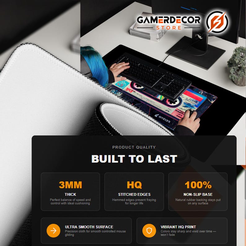May include: A black gaming mouse pad with a colorful cassette tape design. The pad has stitched edges and a non-slip base. The text "GAMERDECOR STORE" is visible. The pad is 3mm thick and has a smooth surface.