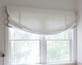 Schumacher Piet Performance (Blanc) Relaxed Roman Shade with Trim shown in Bathroom