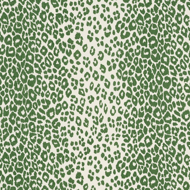 May include: Green and white fabric with a leopard print pattern.