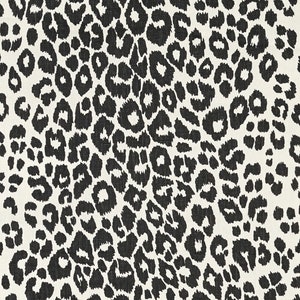 May include: Black and white leopard print fabric with a textured surface.