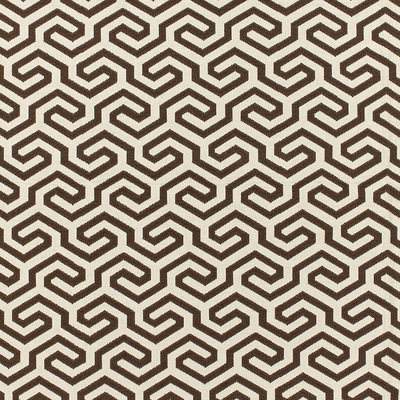 May include: A seamless pattern of brown interlocking geometric shapes on a white background. The pattern is made up of repeating hexagons and squares.