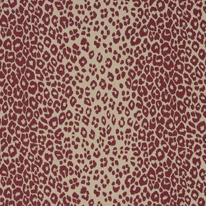 May include: A beige fabric with a repeating pattern of maroon leopard spots.