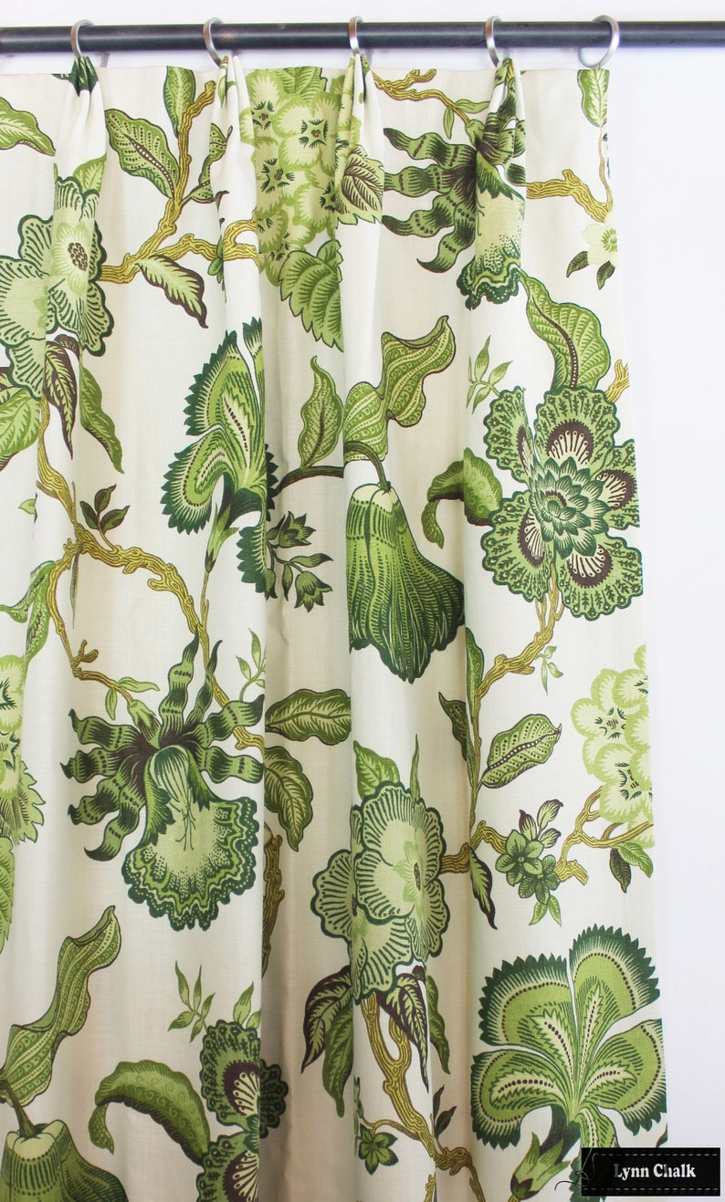 May include: Green floral patterned fabric with a white background. The fabric has a traditional design with large flowers and leaves.