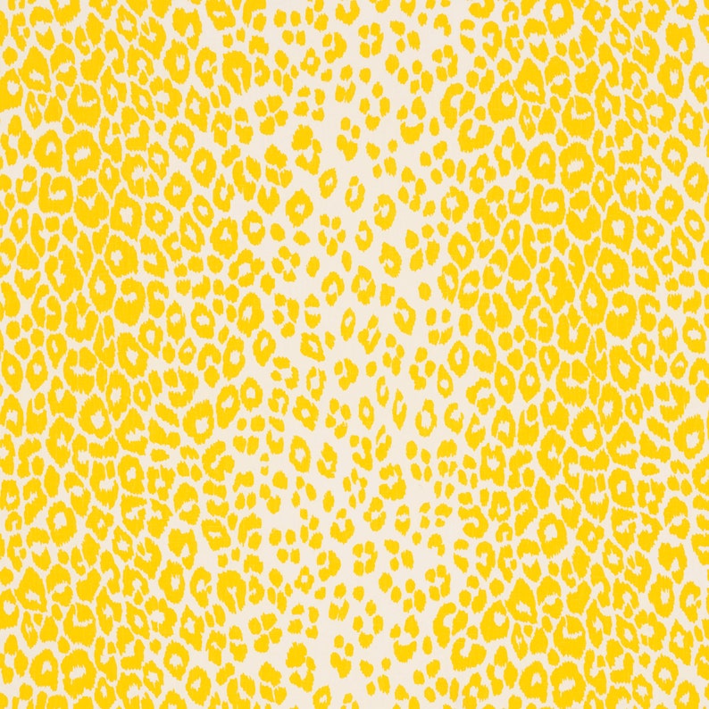 May include: A seamless pattern of yellow leopard spots on a white background.