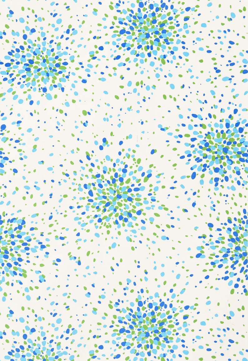 May include: A white background with a repeating pattern of blue and green dots arranged in a burst or star shape.