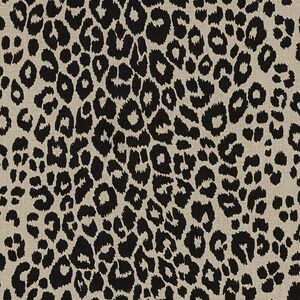 May include: A seamless pattern of black leopard spots on a beige background. The spots are irregular in shape and size, creating a dynamic and textured look.