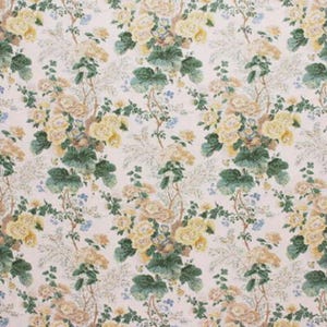 May include: Floral fabric with a repeating pattern of yellow and tan roses, green leaves, and small blue flowers on a cream background. The design has a vintage, botanical aesthetic, suitable for upholstery or crafting.