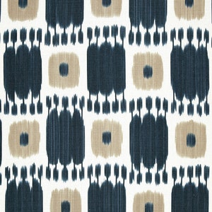 May include: A white fabric with a repeating pattern of blue and tan geometric shapes. The pattern is a stylized ikat design.