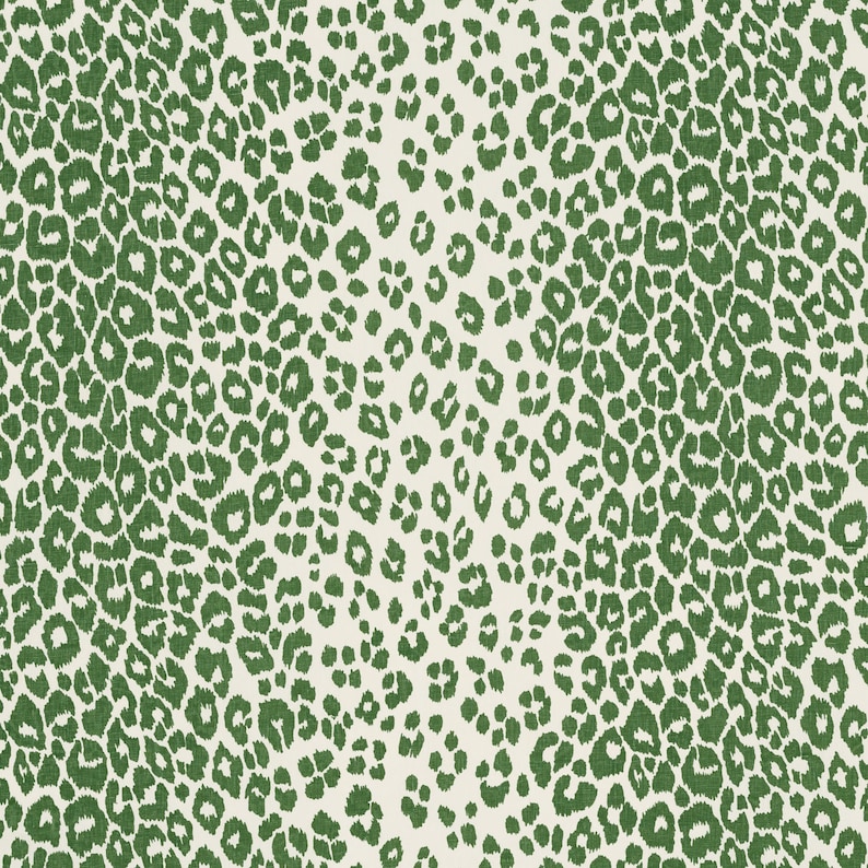 May include: A seamless pattern of green leopard spots on a white background. The spots are of varying sizes and shapes, creating a dynamic and playful design.