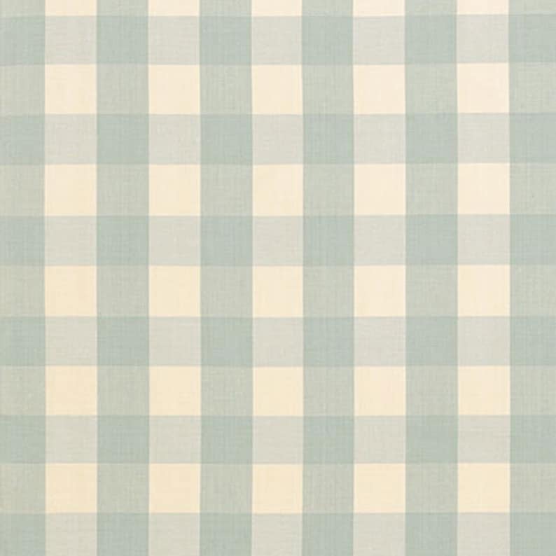 May include: A blue and white gingham fabric with a subtle texture. The fabric has a checkered pattern with alternating blue and white squares.