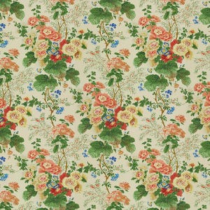 May include: Floral fabric featuring a repeating pattern of large, stylized flowers in shades of peach, yellow, red, and blue. Green leaves and delicate white sprigs fill the spaces between the blooms, all set against a cream background.