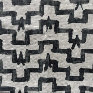May include: Black and white geometric pattern on a canvas fabric. The pattern is made up of thick, brushstroke-like lines that create a zig-zag design.