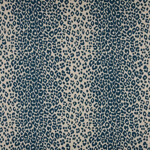 May include: A fabric with a blue and beige leopard print pattern.