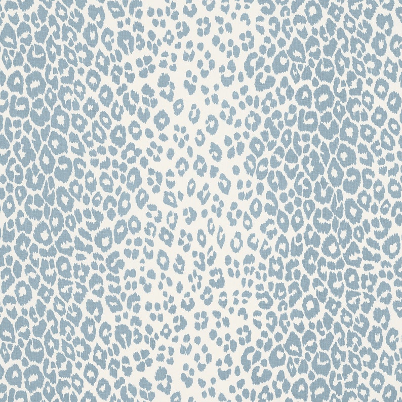 May include: A seamless pattern featuring a light blue leopard print on a white background.
