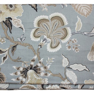 May include: A gray fabric with a floral pattern in shades of brown and beige. The flowers are stylized and have a vintage feel.