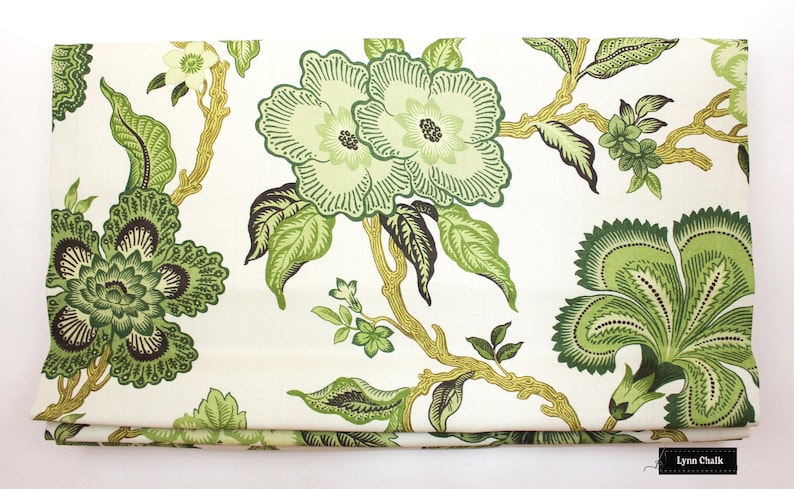 May include: Green floral fabric with a white background. The fabric features a repeating pattern of stylized flowers and leaves.