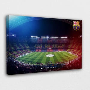 May include: Canvas print of a soccer stadium at night, with a vibrant display of red, blue, and green hues. The stadium is filled with spectators, and the field is illuminated. The FC Barcelona logo is visible.