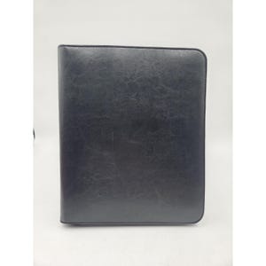 May include: A set of three ceramic mugs with a speckled, cream-colored glaze. Each mug features a different hand-painted design: a blue and green leaf, a yellow and orange flower, and a red berry sprig. The mugs have a simple, rounded shape.