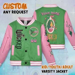 May include: Green and pink varsity jacket with the word "WICKED" on the front. The jacket has a white collar and cuffs with pink sleeves. The back of the jacket has the text "YOUR NAME" and a picture of a princess. The text "CUSTOM ANY REQUEST" is at the top.
