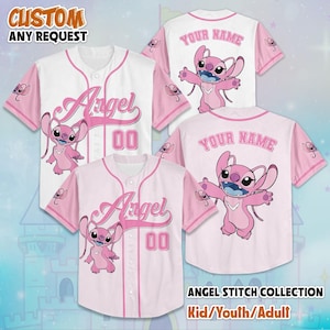 May include: Pink and white baseball jerseys with the word "Angel" and the number "00" printed on the front. The jerseys feature a cartoon character and the text "YOUR NAME" on the back. The image also includes the text "CUSTOM ANY REQUEST" and "ANGEL STITCH COLLECTION Kid/Youth/Adult".