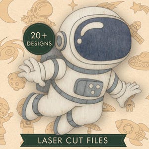 May include: A wooden astronaut cutout featuring a dark blue visor and grey accents, set against a background of various space-themed line art. A dark green circular badge reads 20+ DESIGNS, and a banner at the bottom reads LASER CUT FILES.