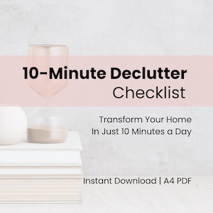 May include: A digital download titled "10-Minute Declutter Checklist" with the text "Transform Your Home In Just 10 Minutes a Day." The image shows a stack of white books, an hourglass, and a white sphere.