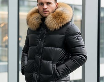 May include: Black puffer jacket with a fur-trimmed hood. The jacket has a button-up front and side pockets. The fur trim is a light brown color. The jacket is made of a shiny material.