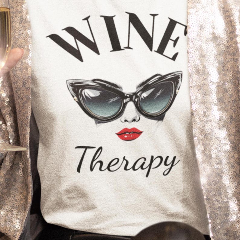 retro wine therapy tshirt with large cat eye sunglasses ready for parties close up of Wine Therapy Bella TShirt Retro Cat Eye Sunglasses Funny Wine Lover Tee Wine Mom Shirt Wine Gift for Her Vintage Wine Glamour Sunglasses Tee with sparkling jacket for new year's