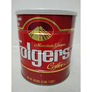 May include: A red Folgers Coffee can with a white lid. The can features the words "Folgers Coffee" in white lettering, with "Mountain Grown" above. The can's net weight is 39 oz (2 lbs 7 oz).