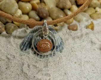 Eye agate inside a silver circle necklace