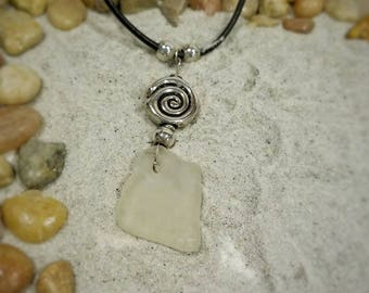 White sea glass with silver swirl on leather cord