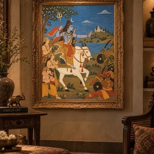 May include: A framed painting depicting a blue-skinned deity riding a white bull, holding a trident, and surrounded by figures in a landscape with a distant temple. The artwork features vibrant colors, intricate details, and a gold ornate frame.