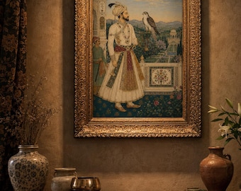 May include: A framed painting depicting a royal figure in white traditional attire standing on a balcony with a falcon perched on their hand. The artwork features intricate details of a garden landscape, a secondary figure, and an ornate gold frame.