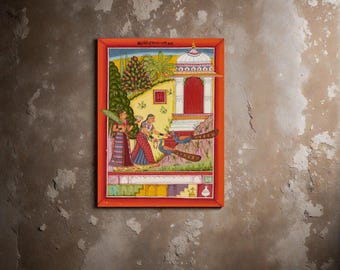 May include: A framed Indian miniature painting with an orange border. The artwork depicts figures in traditional attire, peacocks, and architectural elements. The color palette includes reds, blues, greens, and yellows, creating a vibrant and detailed scene.