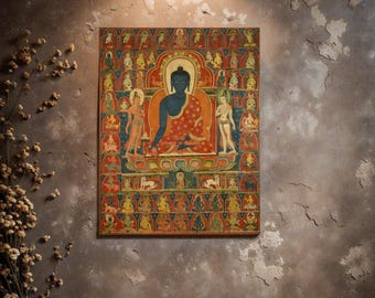 May include: A framed, colorful Buddhist artwork featuring a central seated figure with a blue complexion and red robes. The artwork is surrounded by numerous smaller figures and detailed patterns, set against a textured background.