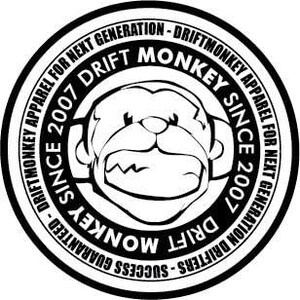 May include: A black and white circular graphic featuring the text "DRIFT MONKEY" and "SINCE 2007". The graphic includes a cartoon monkey face with headphones and the words "DRIFTMONKEY APPAREL FOR NEXT GENERATION" around the edge.