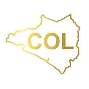May include: A gold outline of a map with the letters "COL" in the center. The map is of a country, and the letters are in a bold, sans-serif font. The background is white.