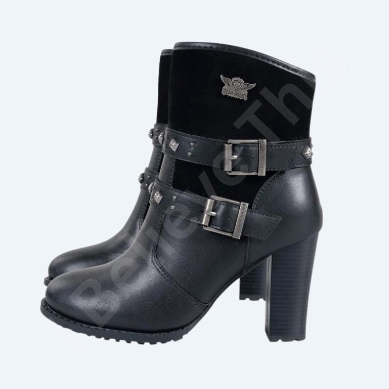 May include: Black leather ankle boots with a block heel. The boots have a suede panel at the top, embellished straps with buckles, and decorative studs. A metal emblem is visible on the suede panel.