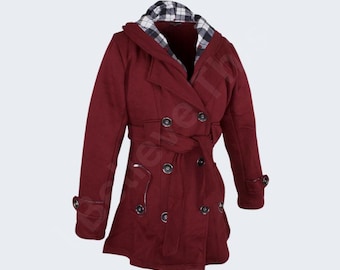 May include: A burgundy double-breasted coat with a hood featuring a black and white plaid lining. The coat has a belt at the waist, multiple buttons, and decorative details on the sleeves. The coat is designed for cold weather.