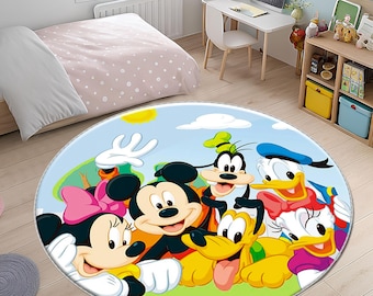 May include: A round area rug featuring a colorful illustration of Disney characters Mickey Mouse, Minnie Mouse, Goofy, Donald Duck, and Pluto. The rug has a blue sky background with a green border and is designed for a child's room.