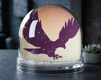 Silhouette einer Adler-Schneekugel