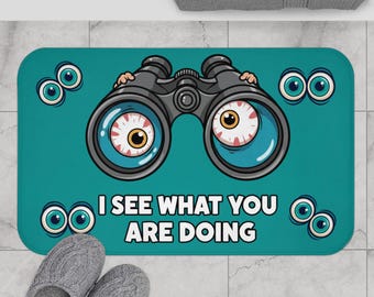 Mata łazienkowa z lornetką „Widzę, co robisz” | zabawna ilustracja gałki ocznej