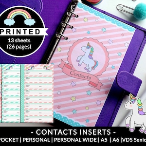 May include: Printed contact inserts for a planner or notebook. The inserts feature a pink and blue striped background with white stars and a unicorn illustration. The text "Contacts" is printed on a pink banner. The inserts are designed for a pocket, personal, personal wide, A5, A6, or VDS Senior size planner.