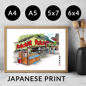 May include: A framed print of a Japanese street food stall with red and yellow signage. The print is in a wooden frame and has options for A4, A5, 5x7, and 6x4 sizes. The words "JAPANESE PRINT" are at the bottom.